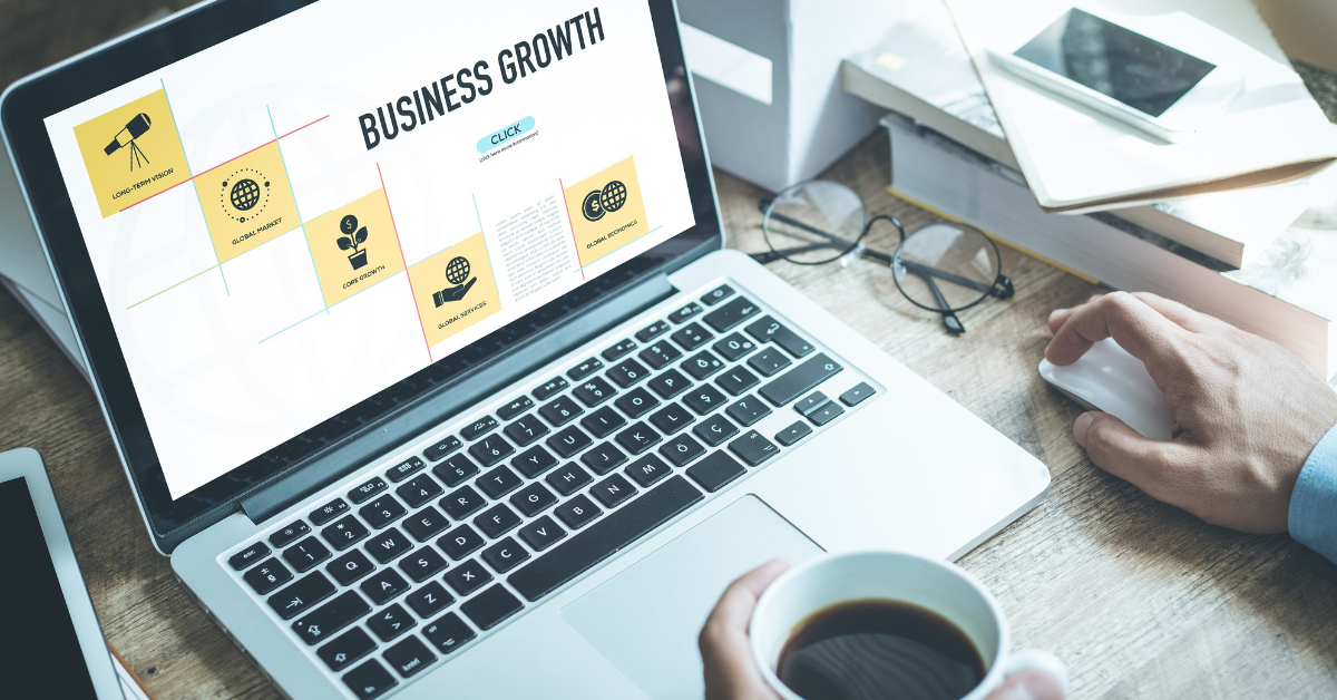 laptop with business growth powerpoint on screen